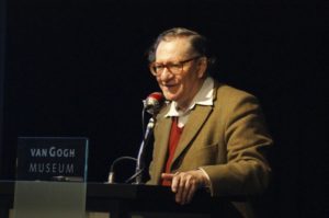 Picture of Anthony Smith speaking at a microphone